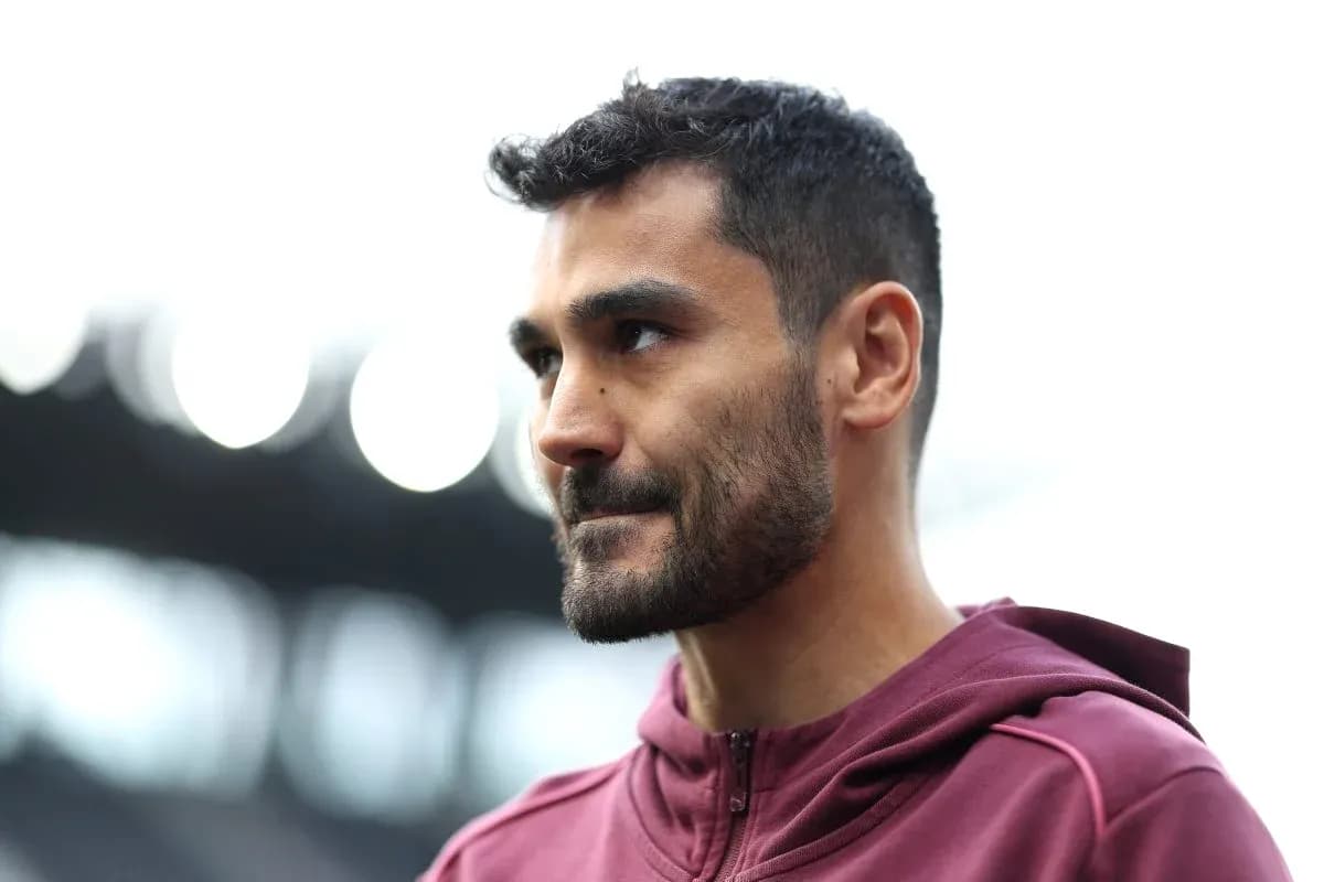 Player in maroon training gear at stadium