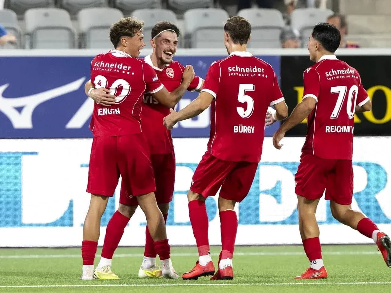 Players celebrating a goal during Europa League match