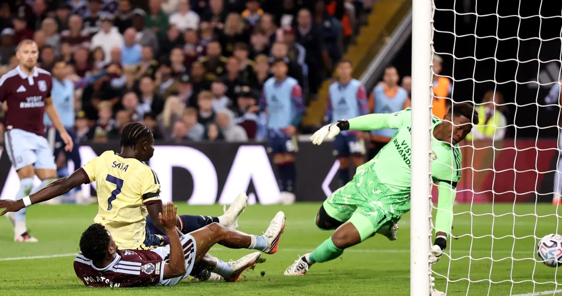 Player colliding during Aston Villa vs Arsenal match