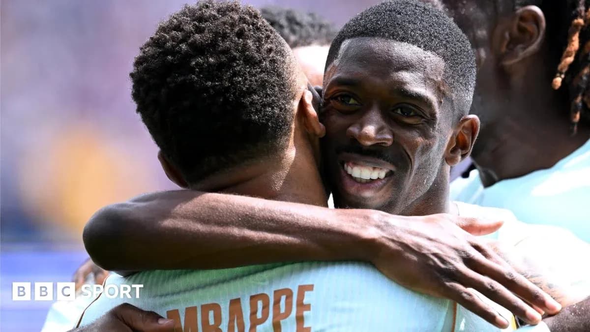 Players celebrating with an embrace on the field