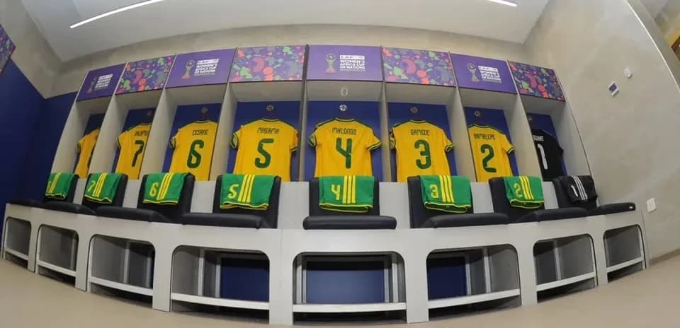 Soccer jerseys hanging in a locker room