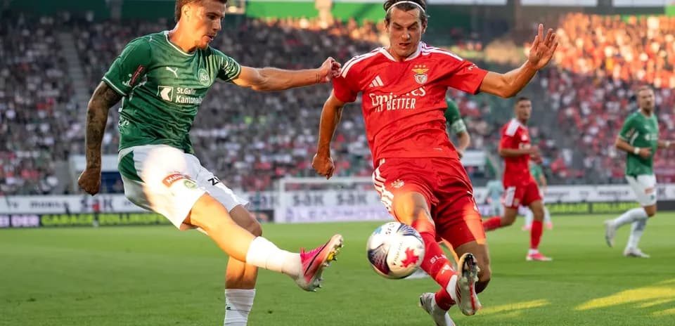 Benfica player tackling FC St. Gallen opponent