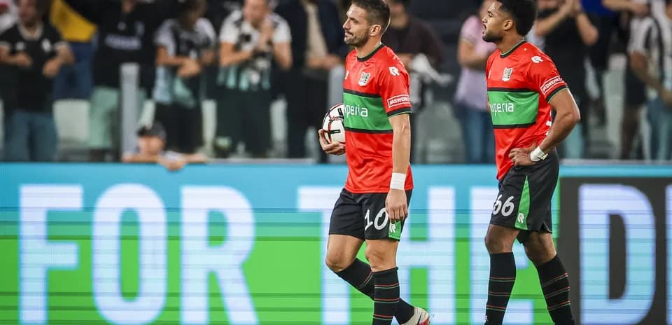 Two players walking off the field after a match