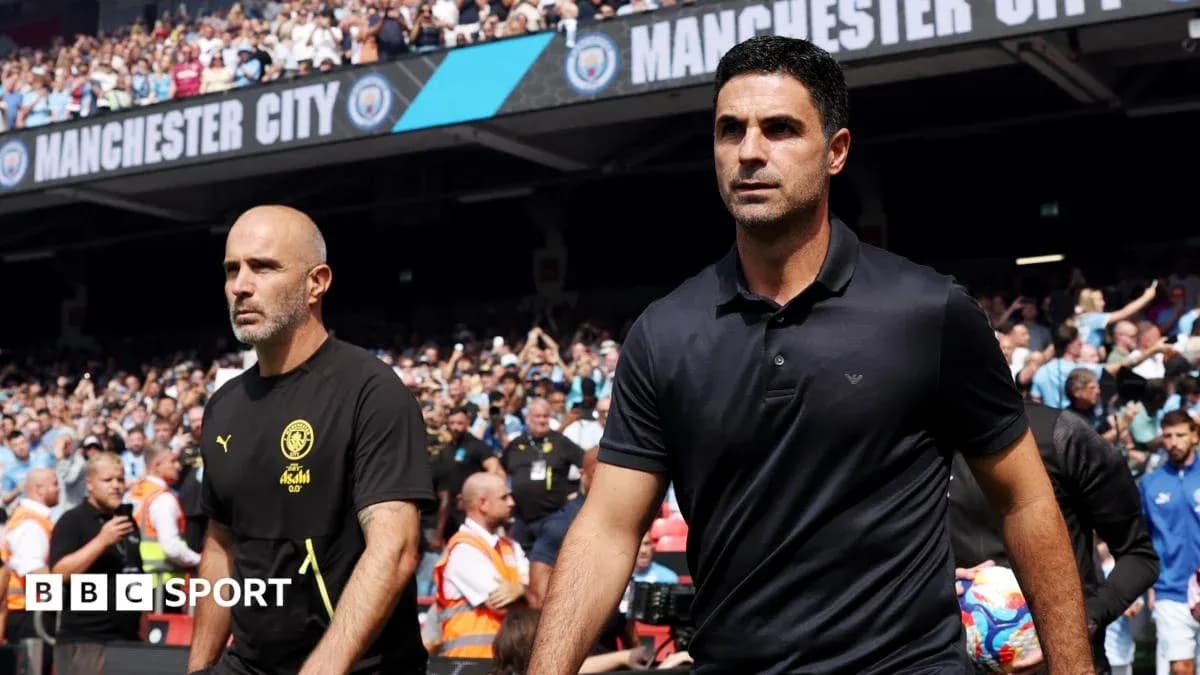 Two football managers walking onto the pitch Two football managers walking onto the pitch