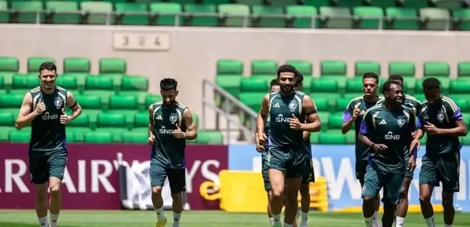 Players jogging during training session on the pitch