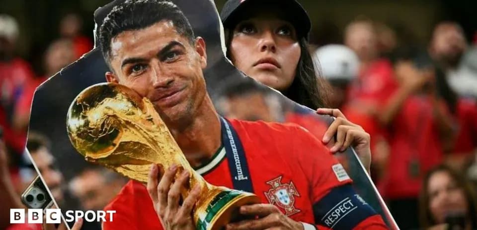 Fan holding cutout of player with trophy