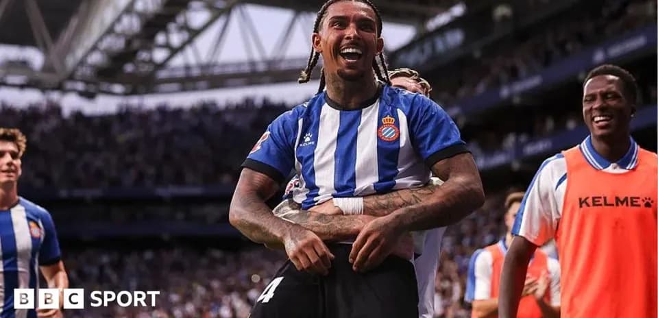 Espanyol player celebrating with teammates after scoring