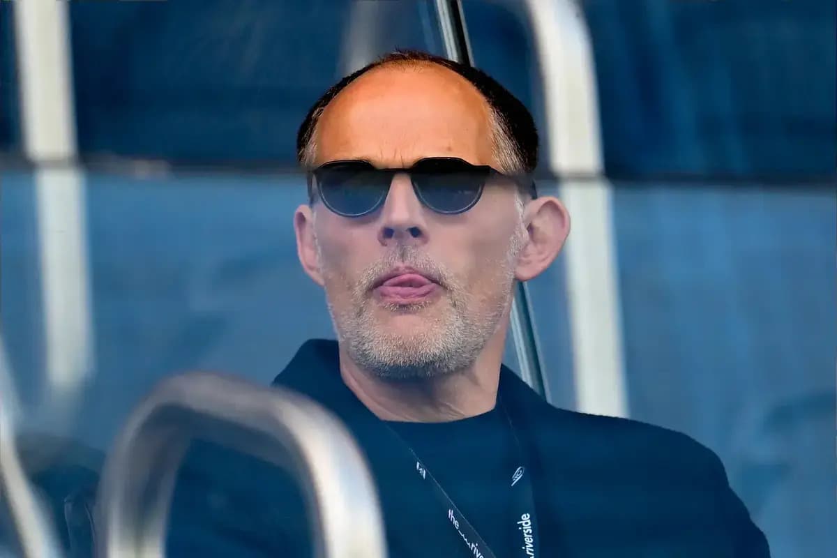Man in sunglasses observing from a booth