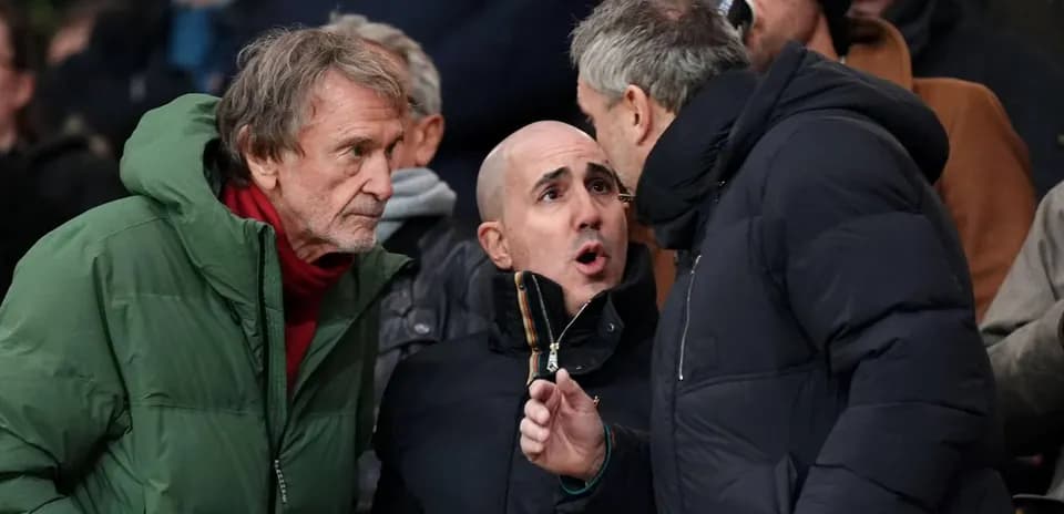 Three spectators discussing during a sporting event