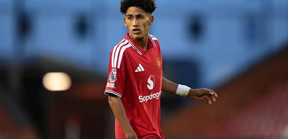 Player in red Manchester United kit on the pitch