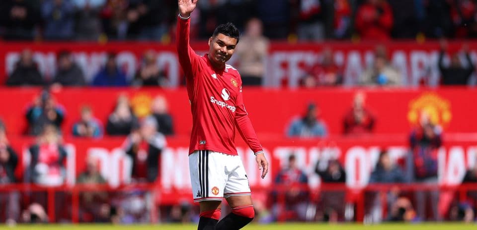Player waving to fans at stadium during match