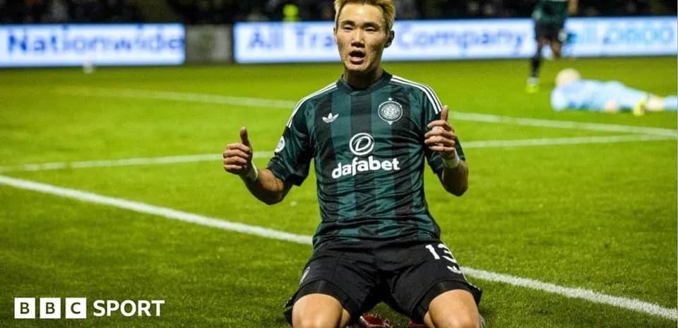 Player celebrating on pitch after scoring a goal