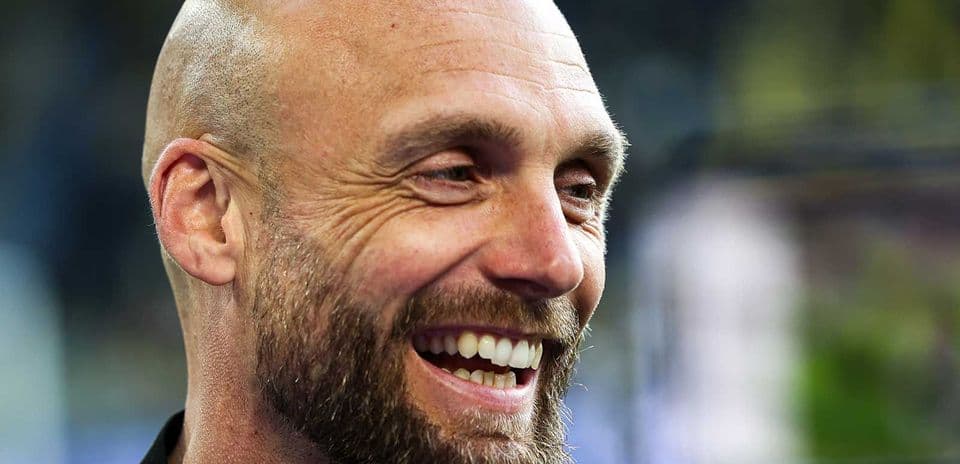 Smiling man with a beard at an event