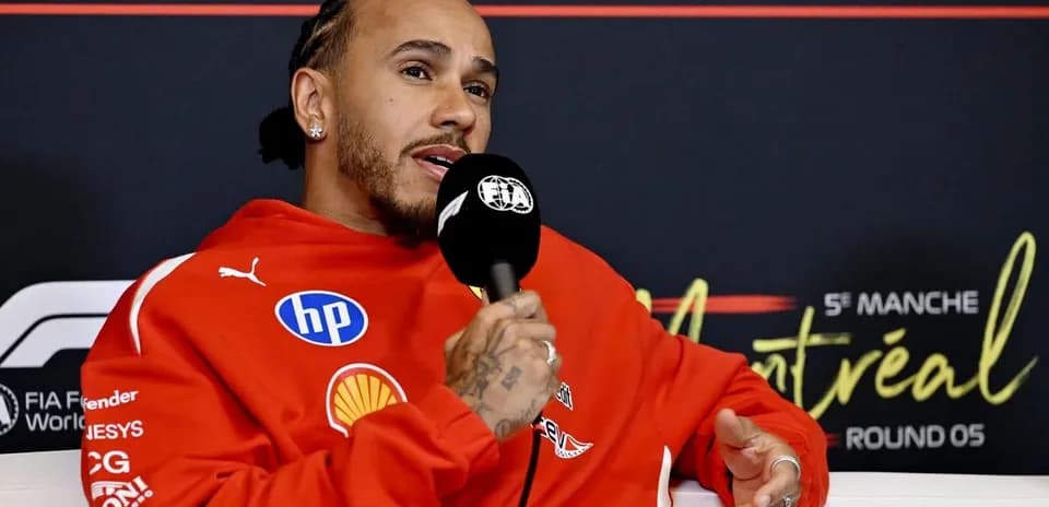 Driver speaking into microphone at press conference