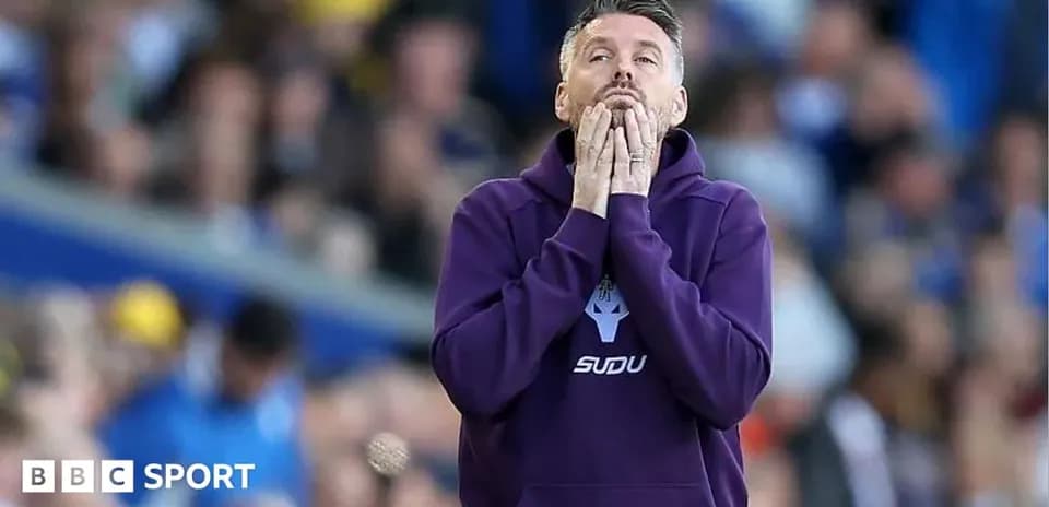 Coach reacting during a tense moment of the match