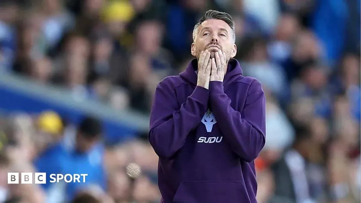 Coach reacting during a tense moment of the match