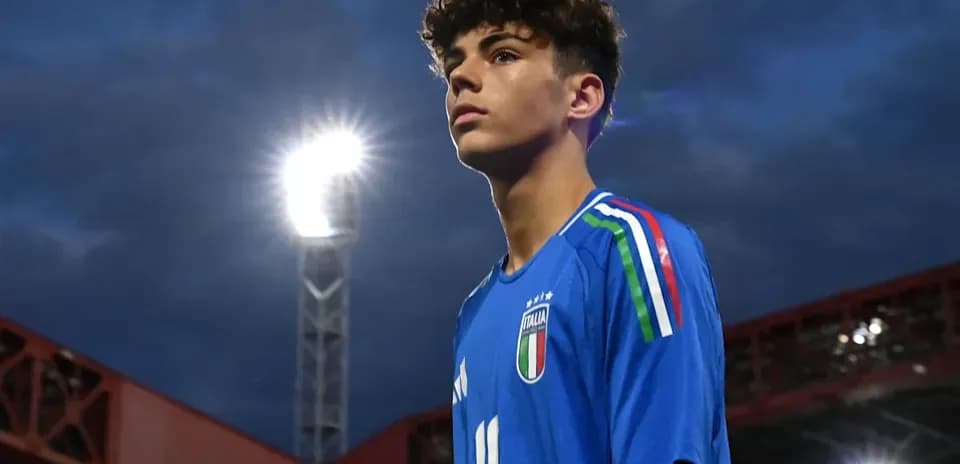 Young player in Italy jersey at stadium