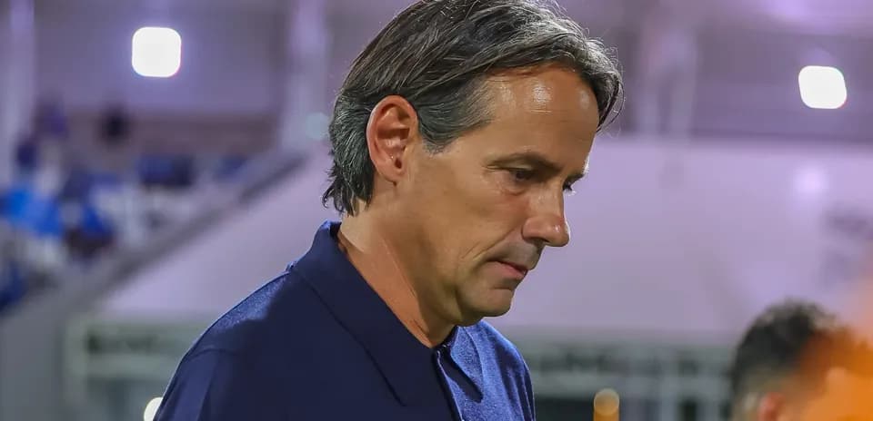 Coach walking on the sidelines during a match