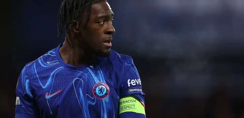 Player wearing Chelsea kit with captain's armband