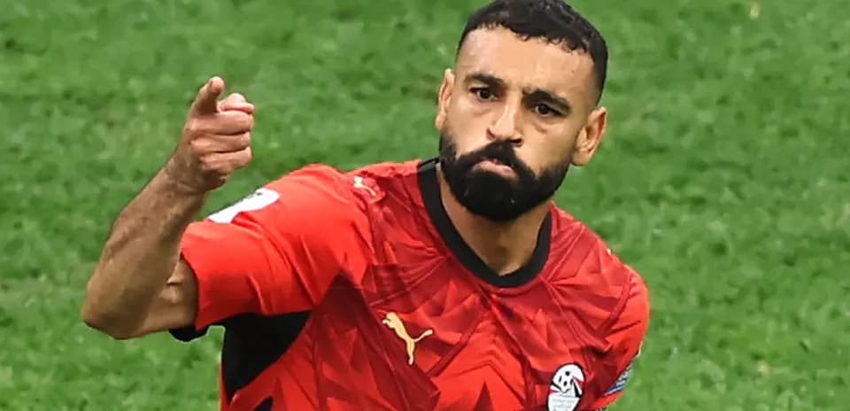 Player celebrating goal in Egypt national team jersey