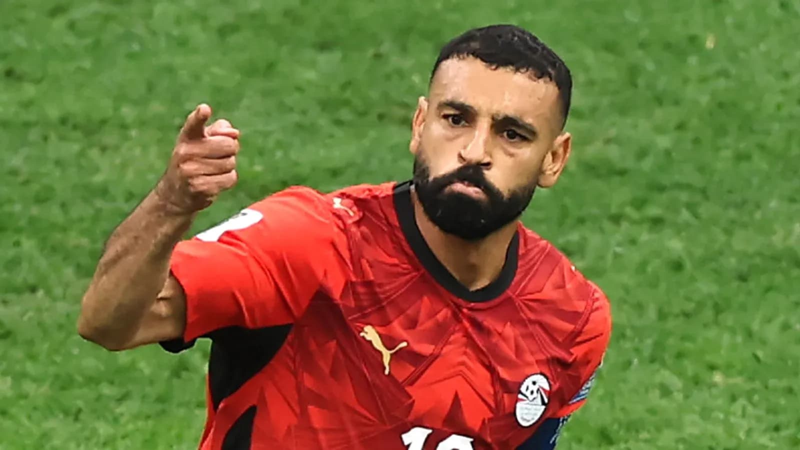 Player celebrating goal in Egypt national team jersey