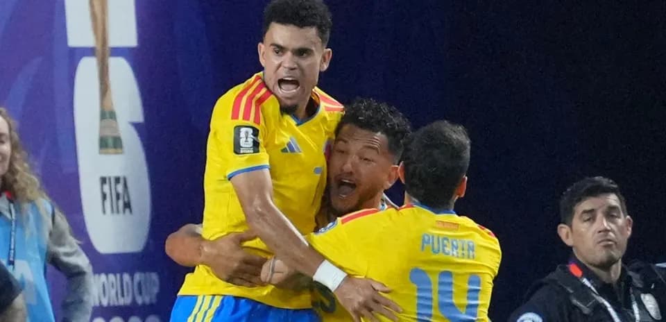 Players celebrating a goal during a match