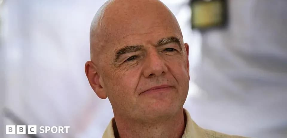 Man with a bald head, wearing a light shirt