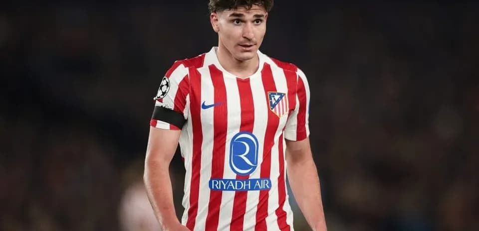 Atletico Madrid player in striped home kit