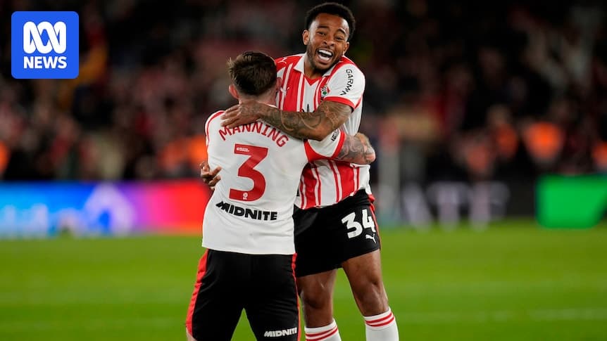 Two players celebrating a victory on the pitch