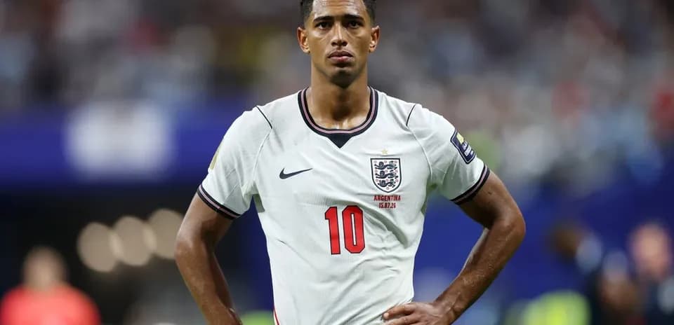 Player in England kit during match, hands on hips