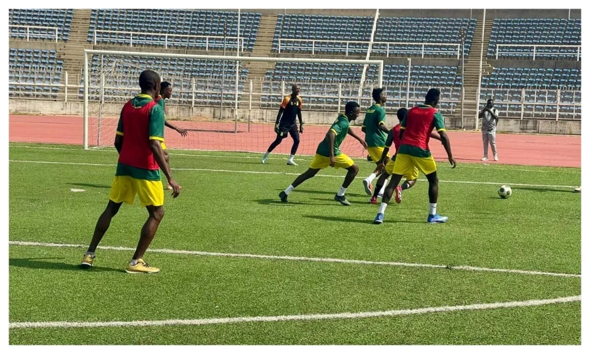 Players training on the pitch before match