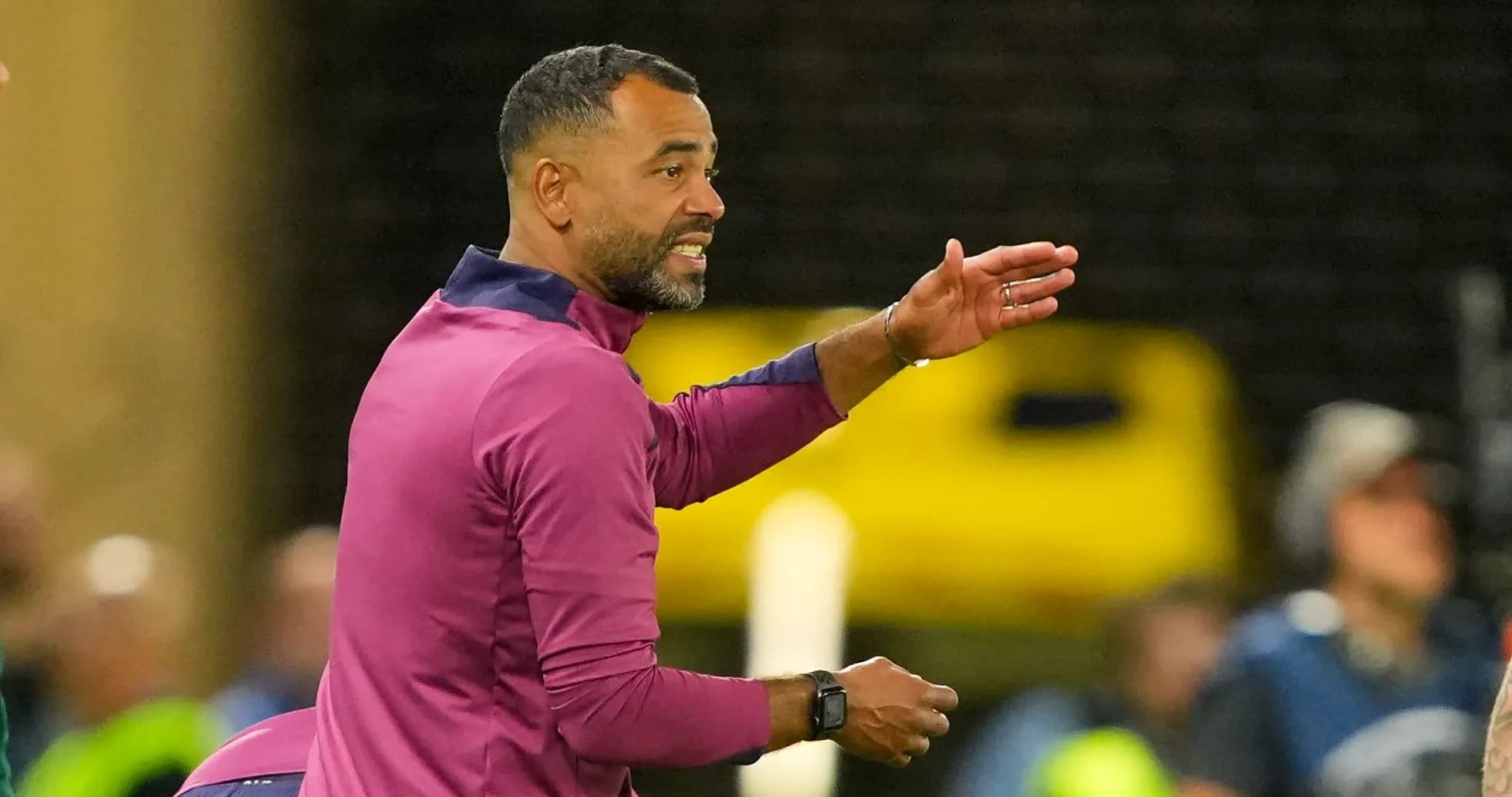 Coach directing players during a match