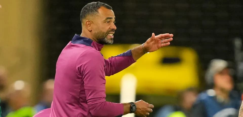 Coach directing players during a match