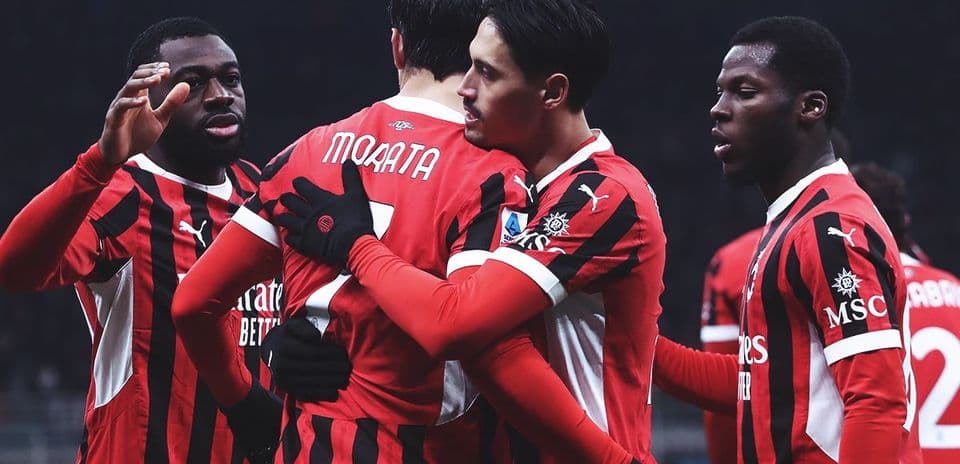 AC Milan players celebrating a goal together