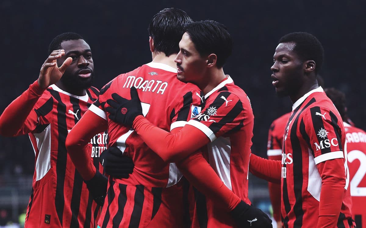 AC Milan players celebrating a goal together