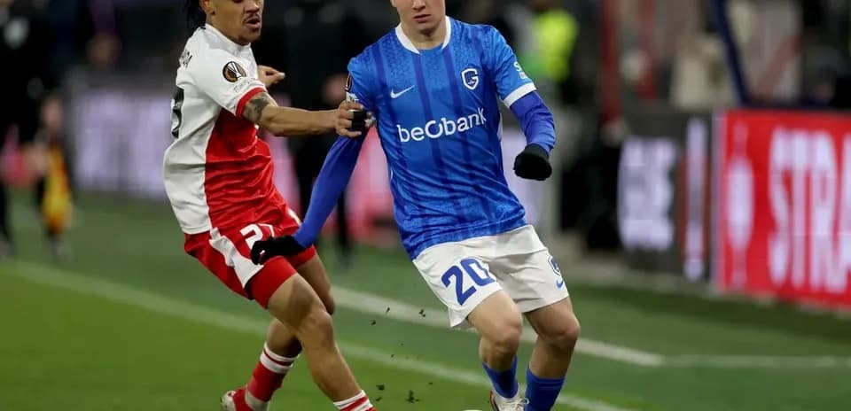 Two players contesting for the ball during match