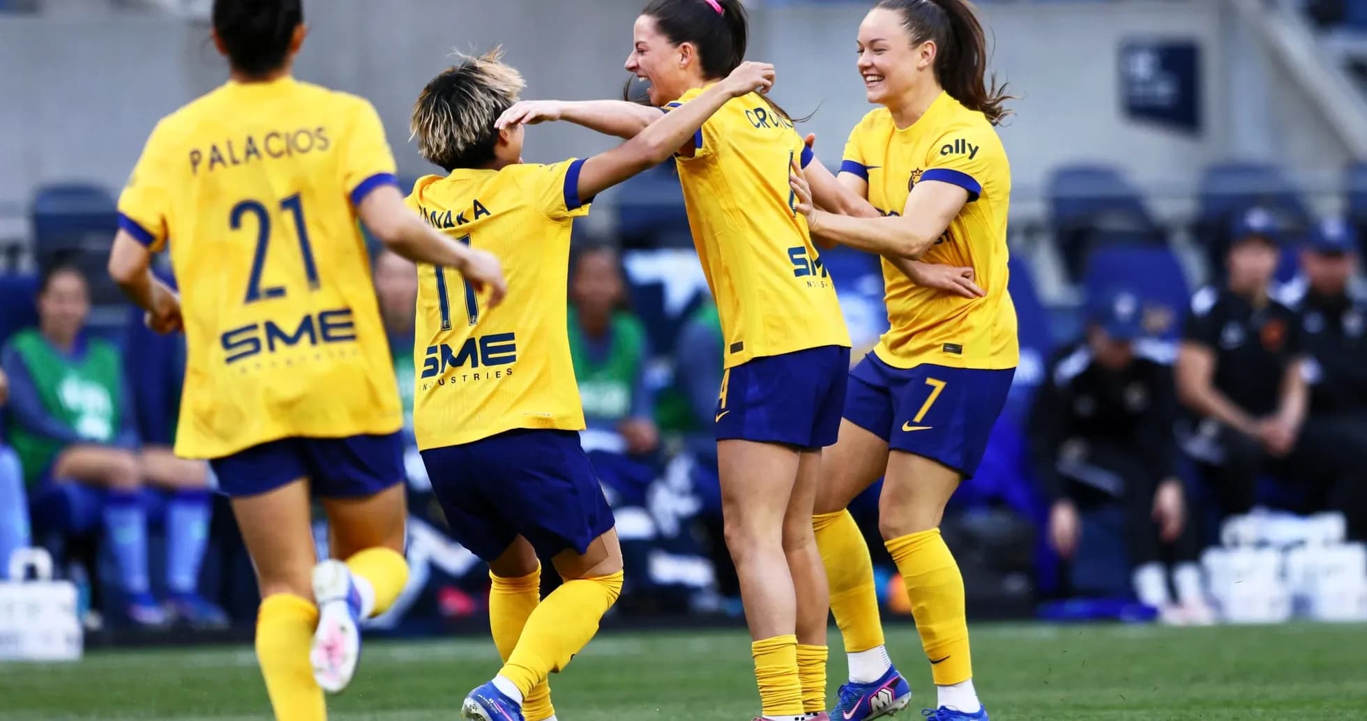 Players celebrating a goal during the match