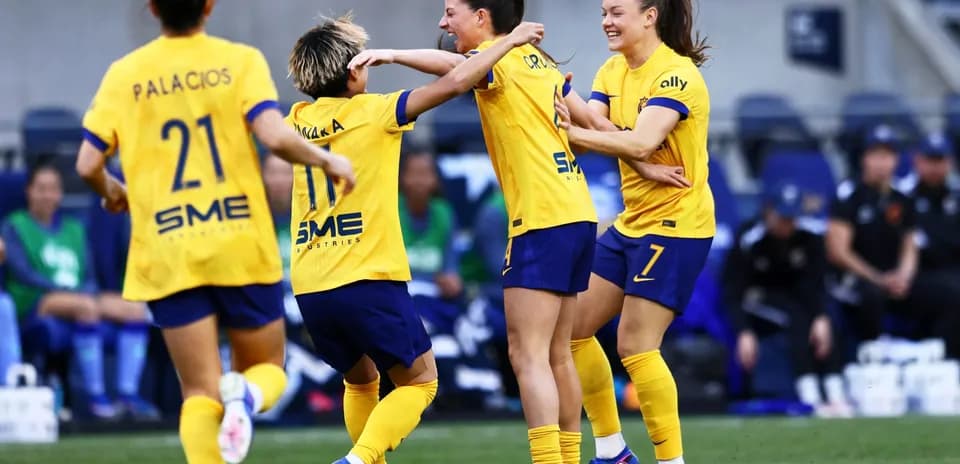 Players celebrating a goal during the match