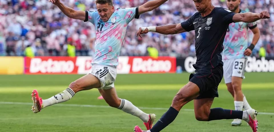 USA player kicking ball against Belgium