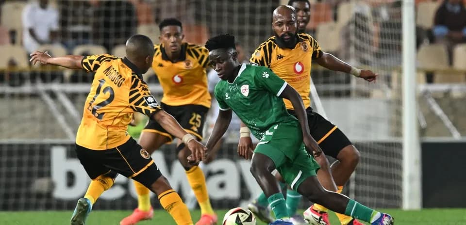 Players contesting for the ball during football match