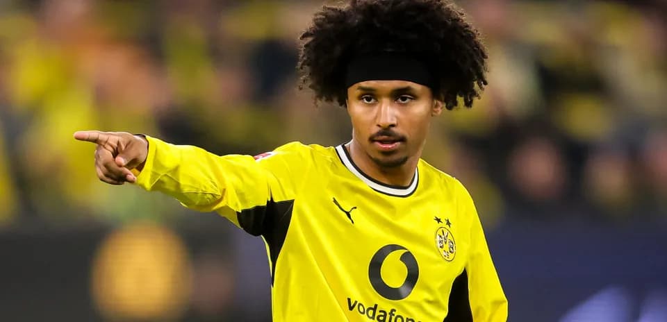 Player pointing during match in yellow jersey