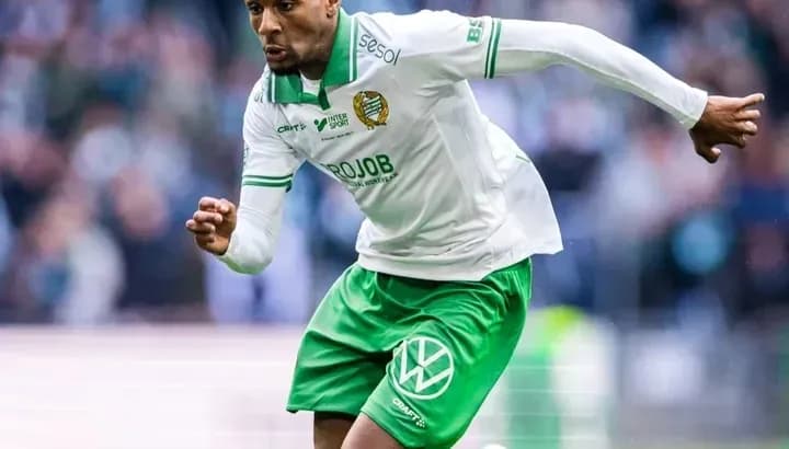 Player running with the ball during a match Player running with the ball during a match