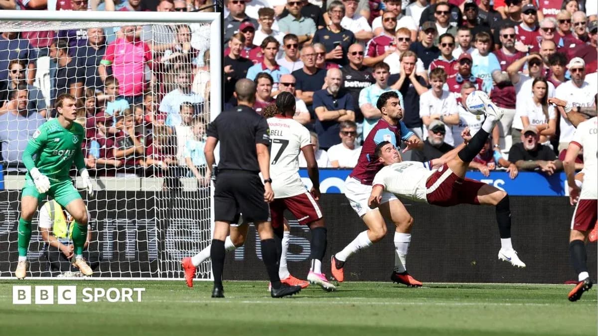 Player attempting bicycle kick near goal during match