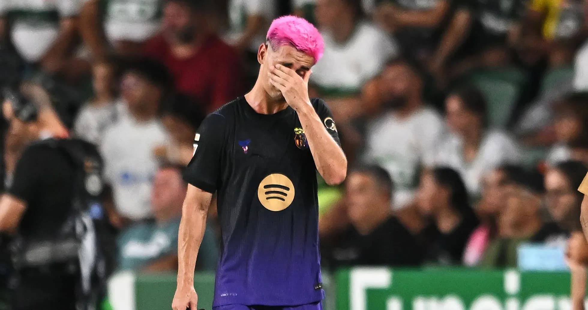 Player with pink hair covering face in disappointment