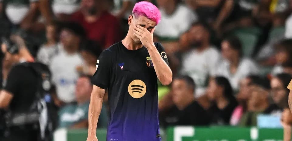 Player with pink hair covering face in disappointment