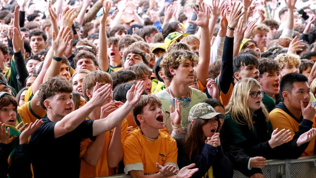 Crowd of fans cheering at a sporting event