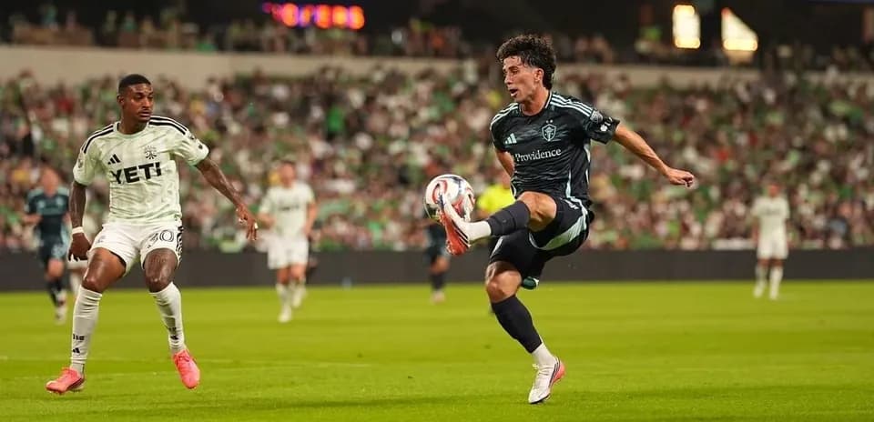 Seattle Sounders player kicking the ball