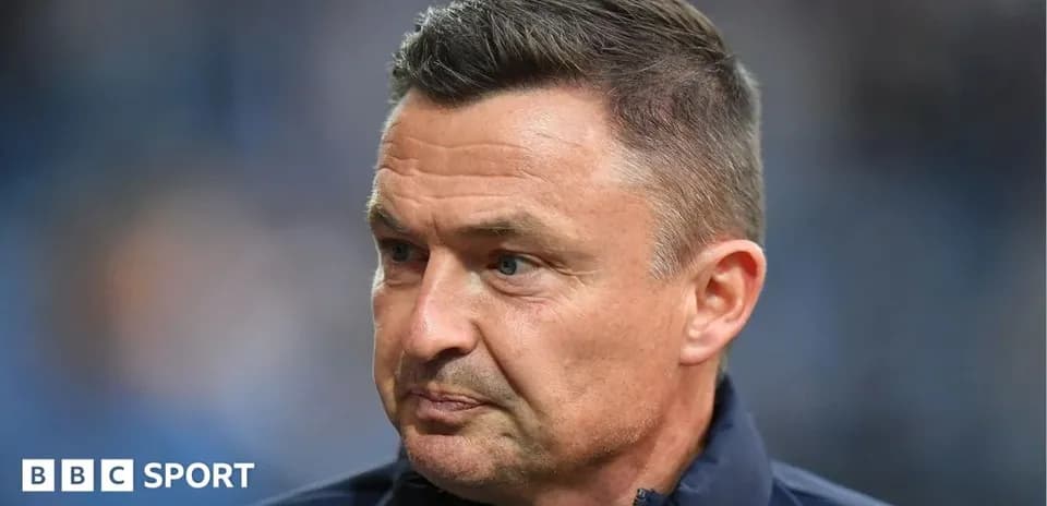 Coach focused during pre-match preparation