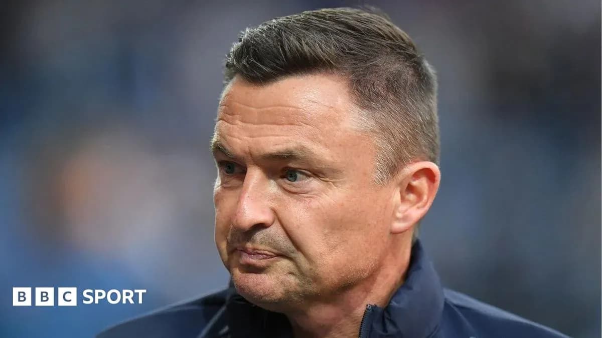 Coach focused during pre-match preparation