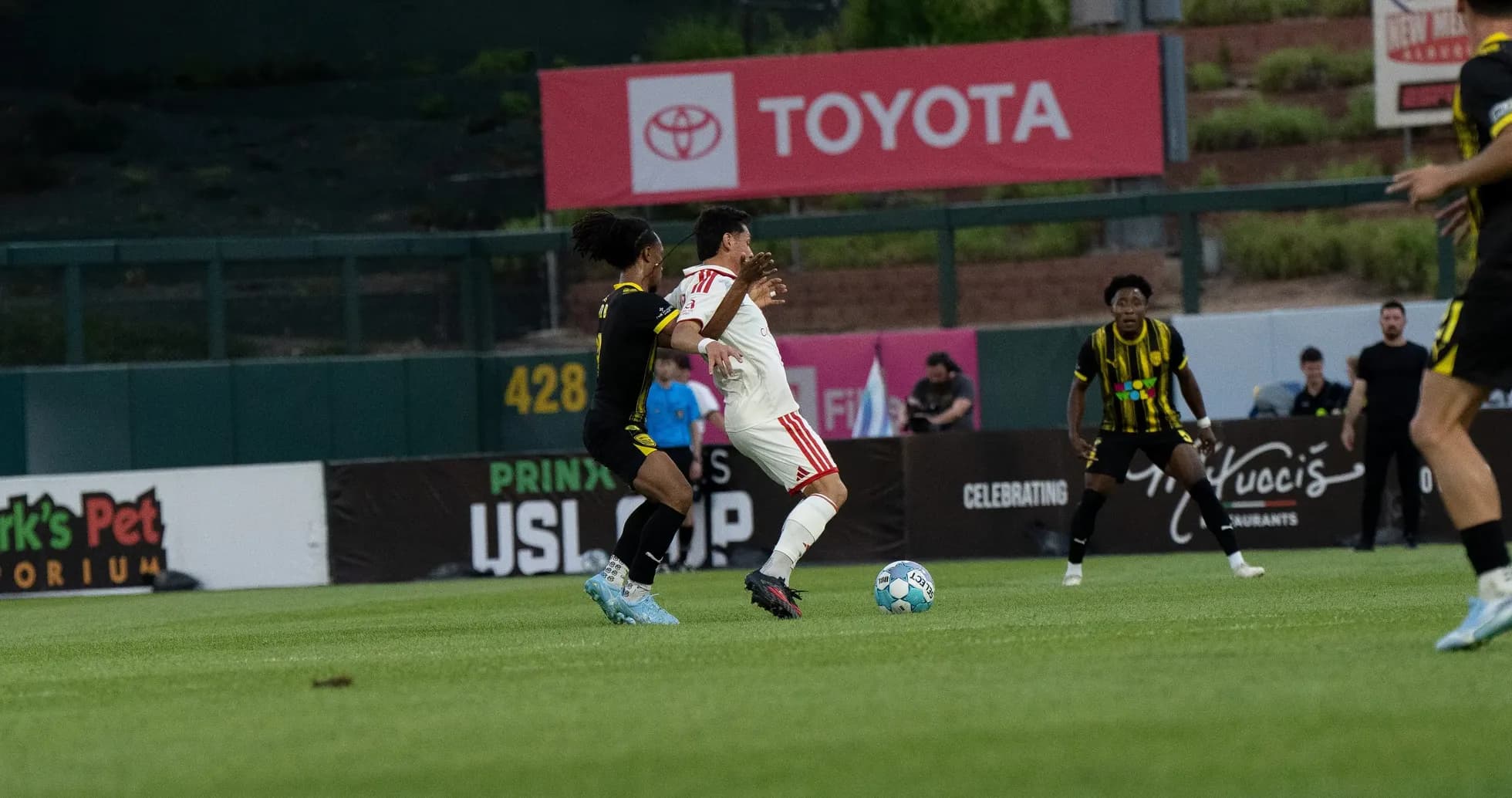Players competing during New Mexico United match